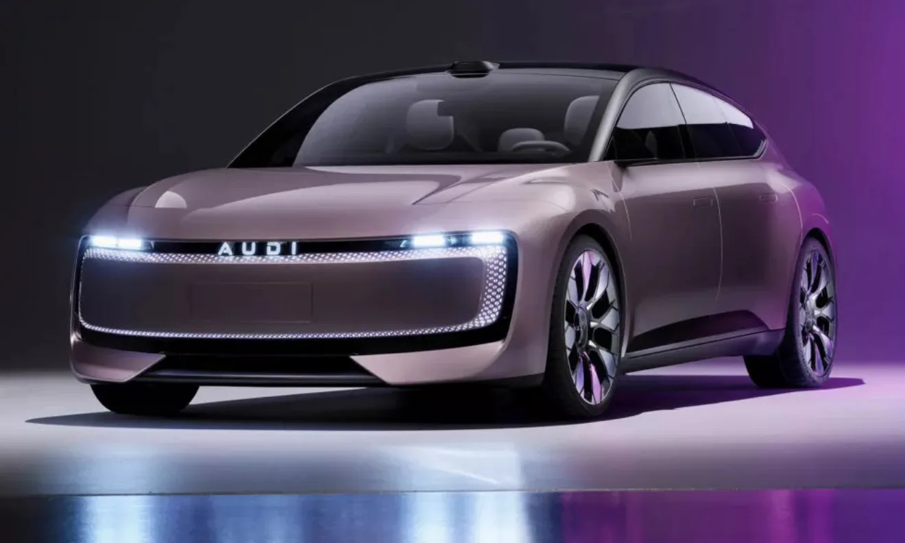 Dianteira do novo AUDI E Concept cinza claro, com faróis acesos e fundo escurecido