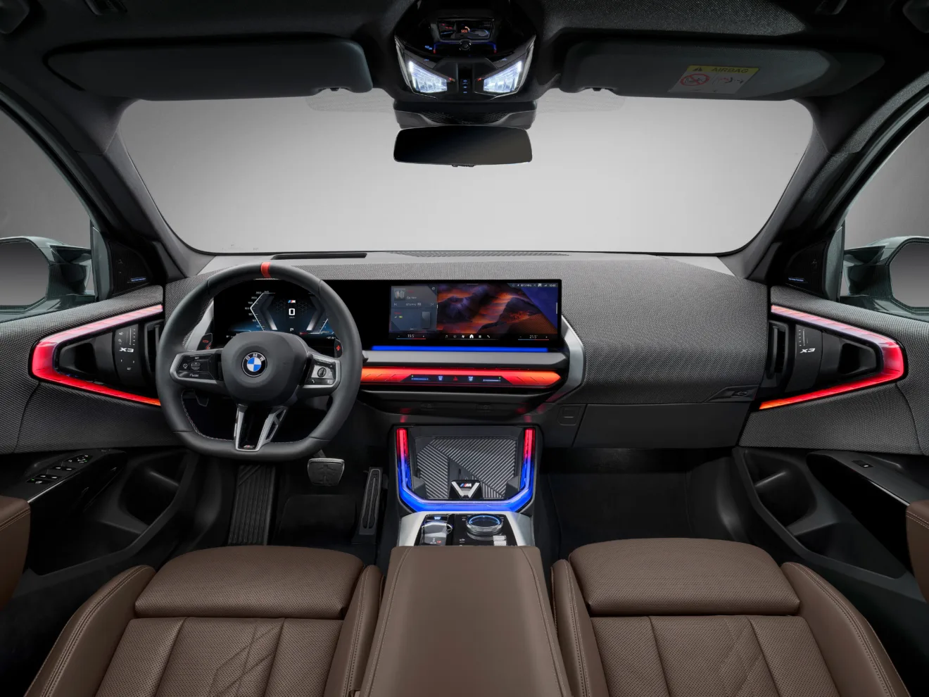 Cabine do BMW X3 M50 xDrive com painel de instrumentos e central multimídia ligados