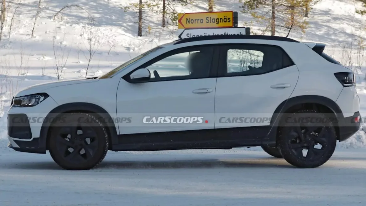 Volkswagen Tera branco com partes pretas, visto de lado e com neve ao fundo