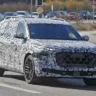 Audi Q9 camuflado de frente andando na estrada