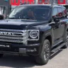 Haval H9 cinza parado de frente