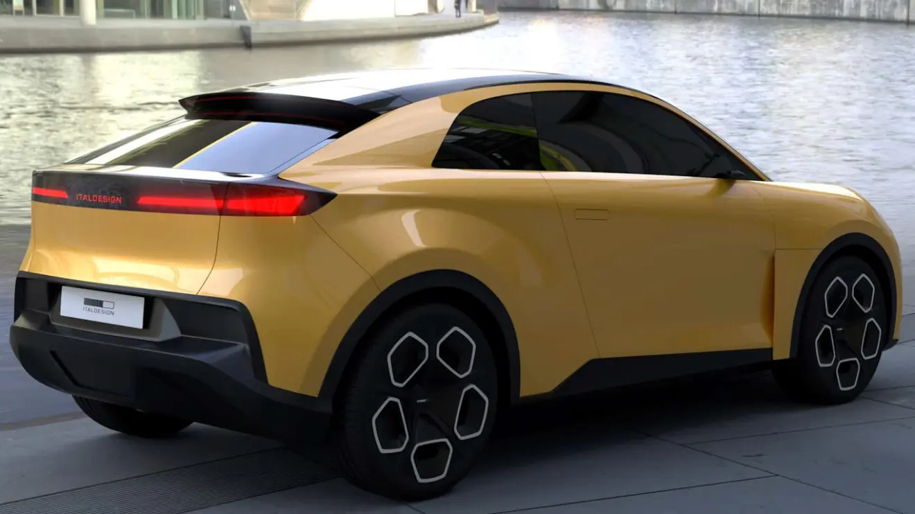 Volkswagen EVX cupê amarelo visto de trás e com lanternas acesas